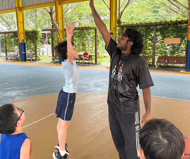 Coach guiding a player