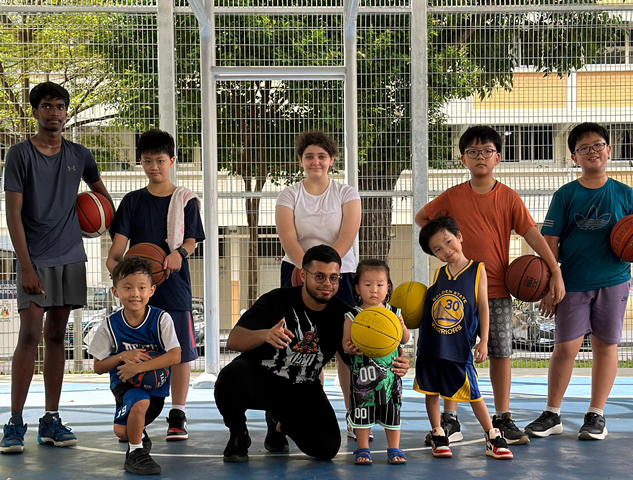 Coach with juniors in a small group