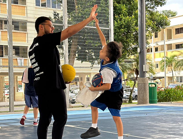 Coach with juniors in a small group
